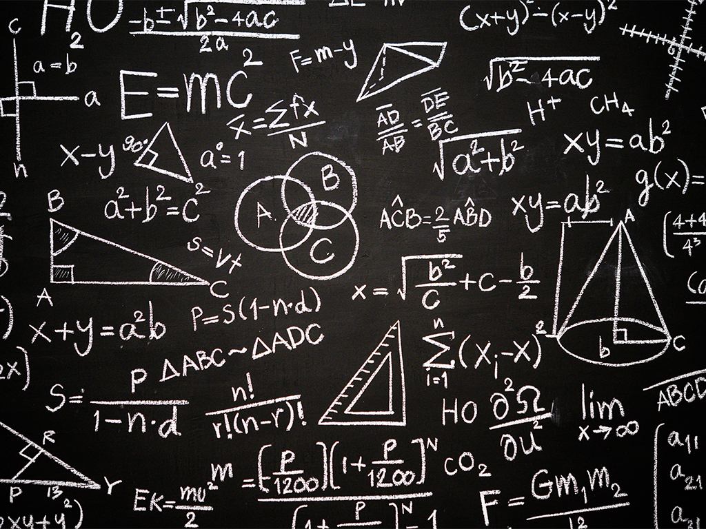 Mathematical formulae written on a blackboard
